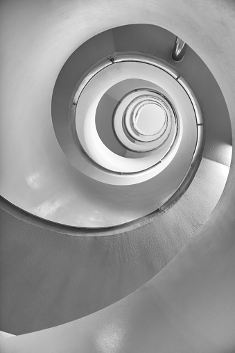 Underneath a concrete spiral staircase