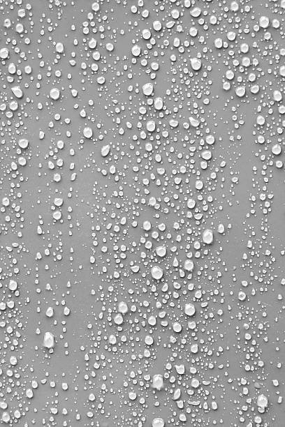 Water drop on grey background. Close up detail water drop on grey background. sweat droplet stock pictures, royalty-free photos & images