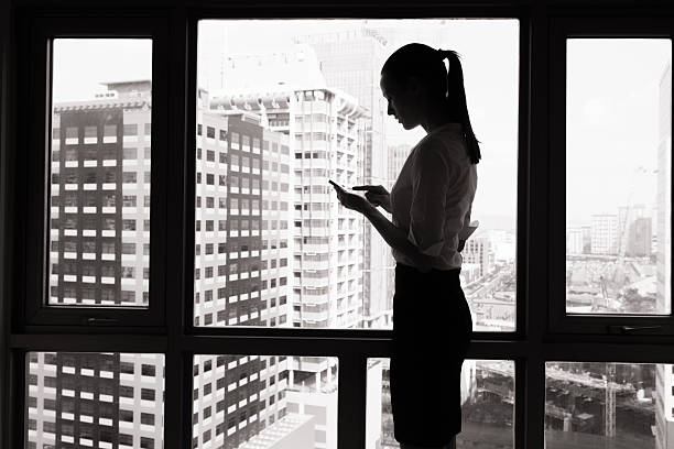 Woman in the city using her phone.
