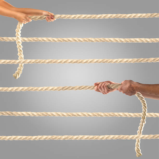 istock Hands of people pulling the rope Competition concept 499809236