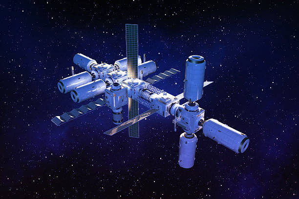 Space station floating in outer space on a star field Simulation of a space station for the exploration of solar system, floating in the outer space with a star field background. Space modules, connected each other through special hubs, allow astronauts to move through the station, Hubs are also supporting solar panels extending into space. Dark blue background with bright light illuminating the back side of the space station. Science innovation, technology and space exploration. international space station stock pictures, royalty-free photos & images