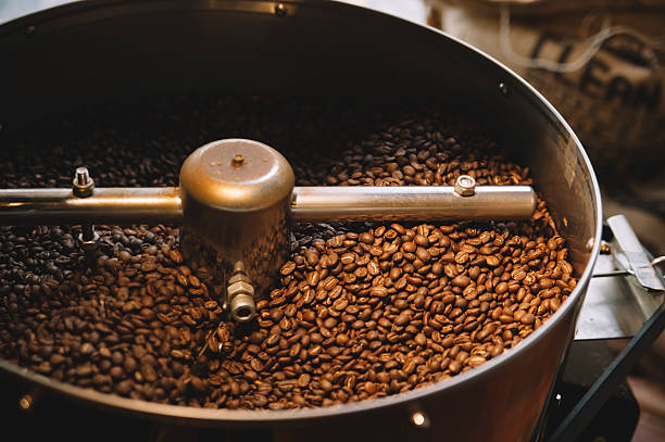 istock freshly roasted coffee beans n a coffee roaster 499809388