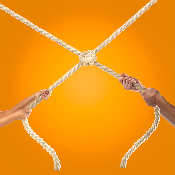 istock Hands of people pulling the rope Competition concept 499809416