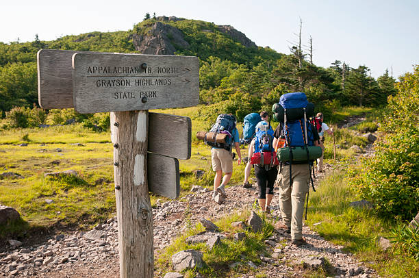 Backpacking in Grayson Highlands State Park, Virginia A group of friends begin a three-day hike on the Appalachian Trail, starting in Grayson Highlands State Park at Elk Garden, on Highway 600. The first night will be spent near Mount Rogers. hiking sign stock pictures, royalty-free photos & images