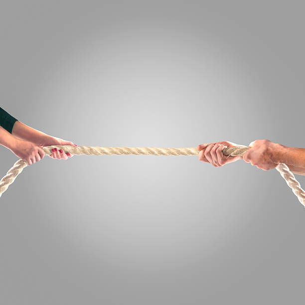 istock Hands of people pulling the rope Competition concept 499810532