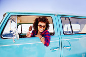 Hipster girl with icecream in camper van