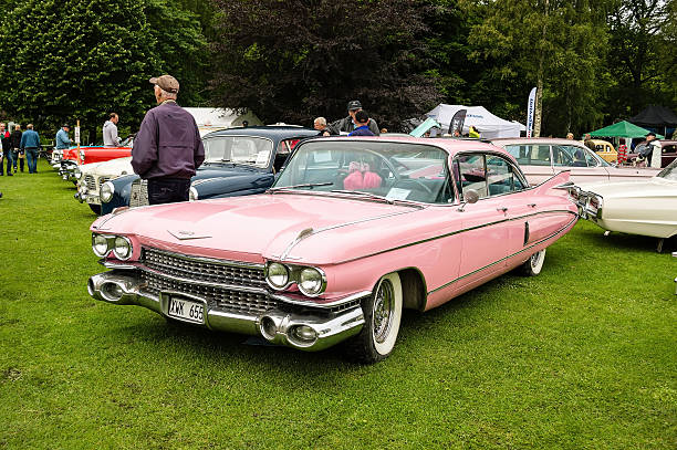 Cadillac Fleetwood 1959 Ronneby, Sweden - June 28, 2014: Nostalgia Festival, classic cars, motorcycles and fashion. Pink Cadillac Fleetwood 1959. 1950 1959 photos stock pictures, royalty-free photos & images
