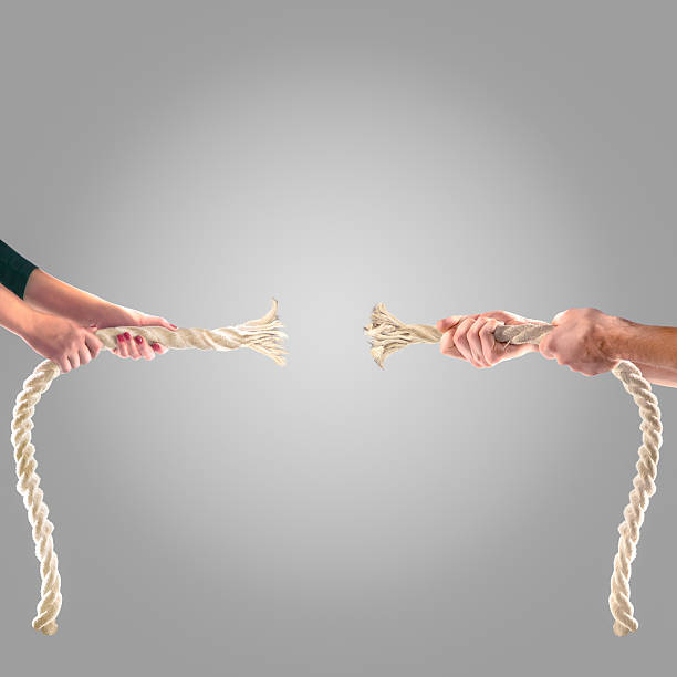 istock Hands of people pulling the rope Competition concept 499810714