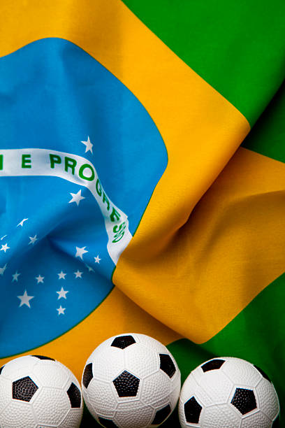 istock Brazilian flag with football 499811683