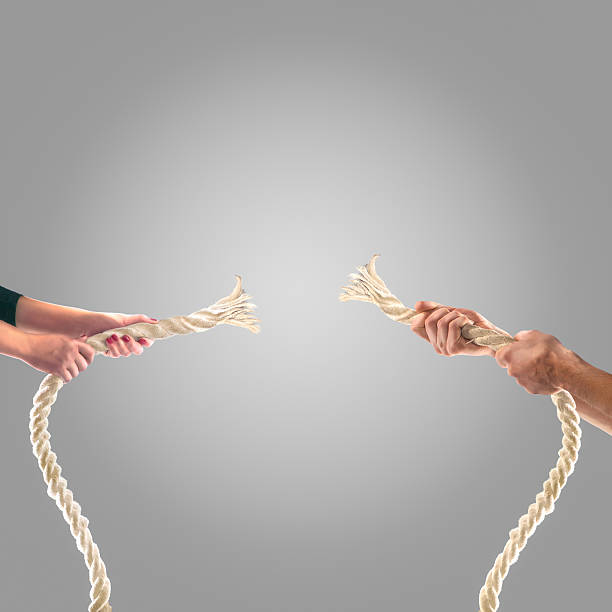 istock Hands of people pulling the rope Competition concept 499812106