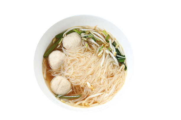 istock noodles soup in white bowl. 499812137