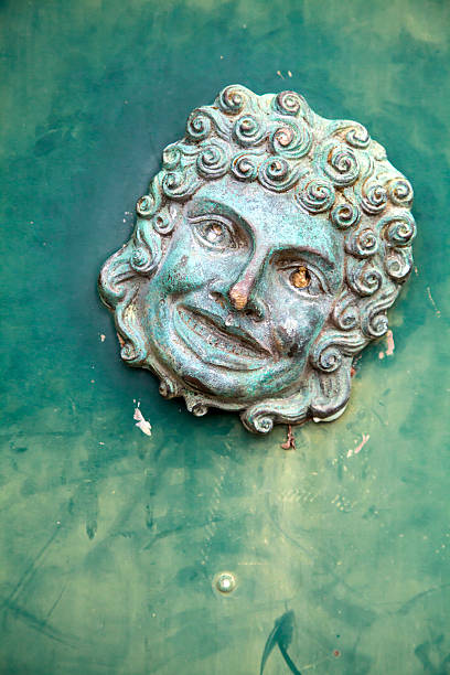 istock Green door with mask decoration 499812242
