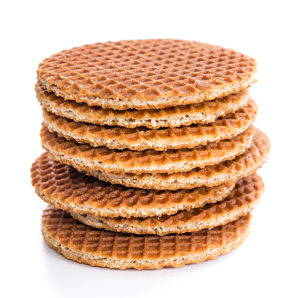 Waffles filled with golden honey (isolated on white background)