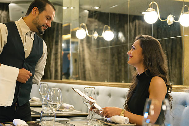 istock Young attractive woman making order at restaurant 499814346