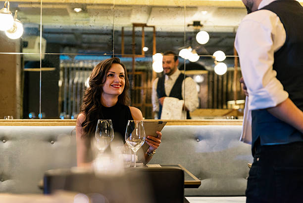 istock Young attractive woman making order at restaurant 499814376