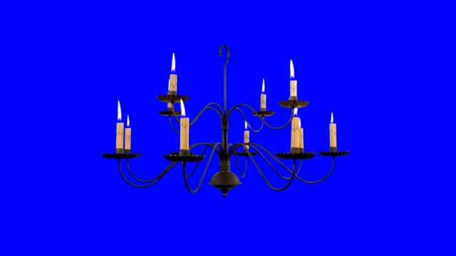Old Chandelier with Burning Candles on Blue Screen Background