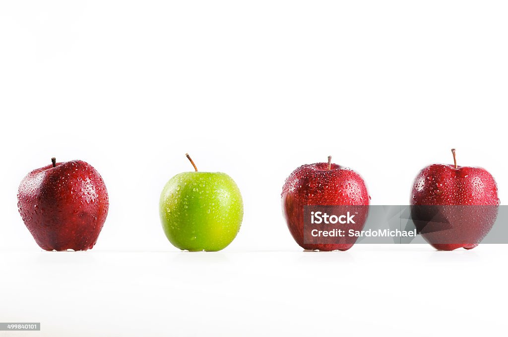 red and green apples green apple in the middle three red apples. isolated on a white background Abundance Stock Photo