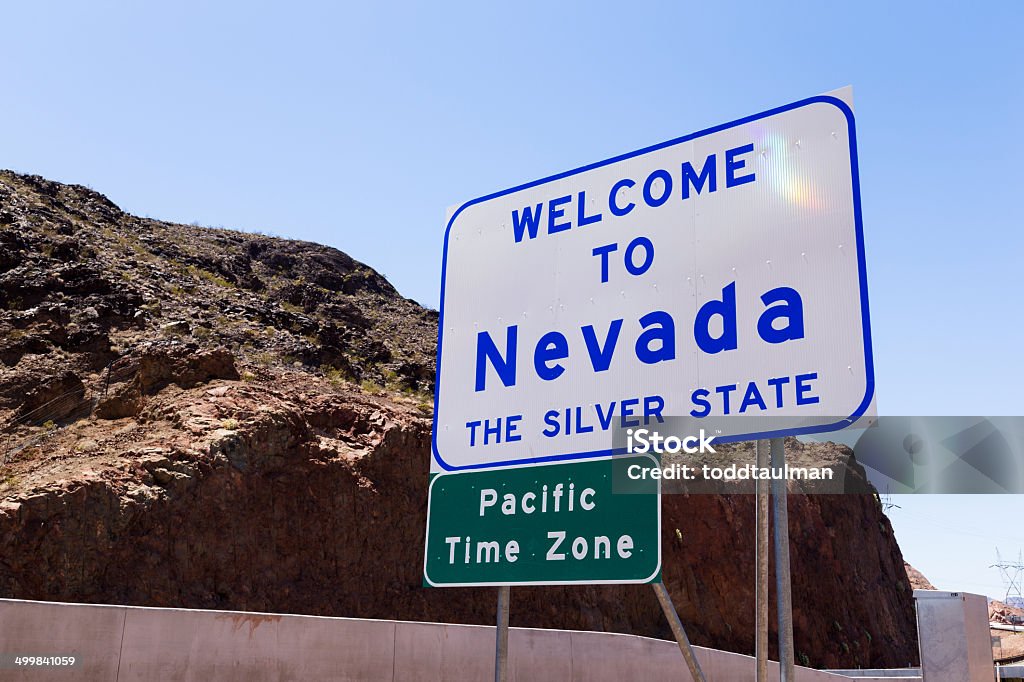 Welcome to Nevada Welcome to Nevada sign along the highway Welcome Sign Stock Photo