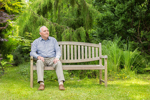 Senior man sitting on bench Senior man sitting on bench sitting on bench stock pictures, royalty-free photos & images