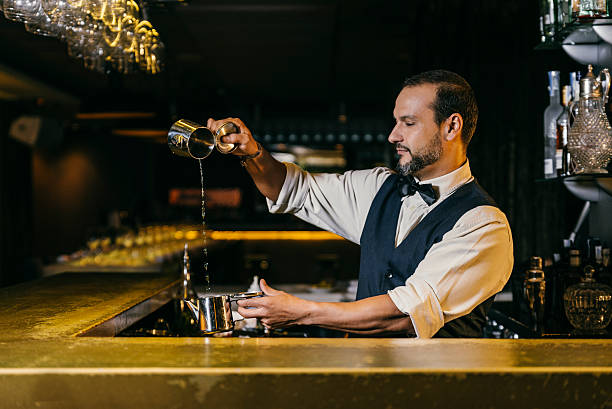 istock Barman is making cocktail at night club 499842386
