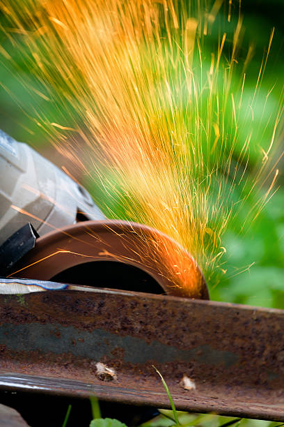 istock sharpening and cutting of iron by abrasive disk machine 499842464