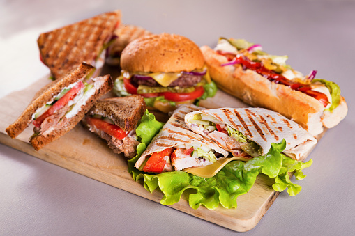 Fast food plate with burger hot dog sandwiches and chicken wrap