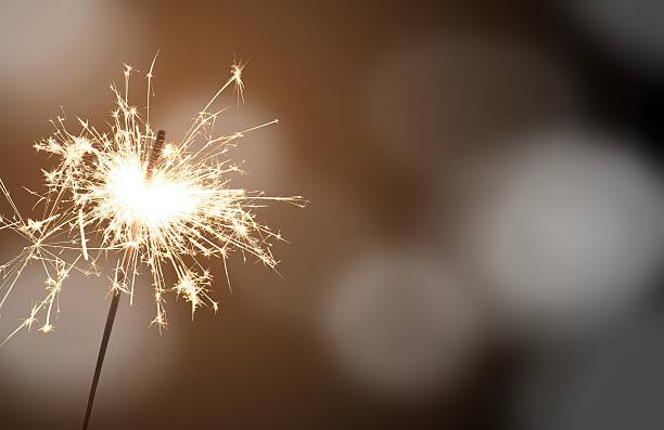 sparkler - New Year's Eve sparkler - celebrating New Year's Eve sparkler stock pictures, royalty-free photos & images