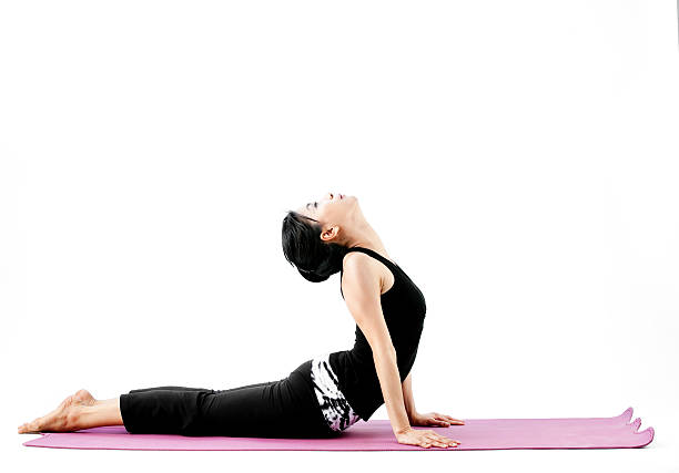 istock young beautiful yoga posing on a white studio background 499844771
