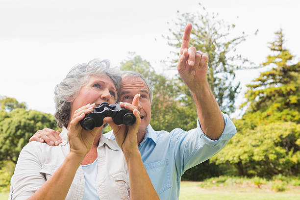 istock Man showing something to his wife holding binoculars 499845359