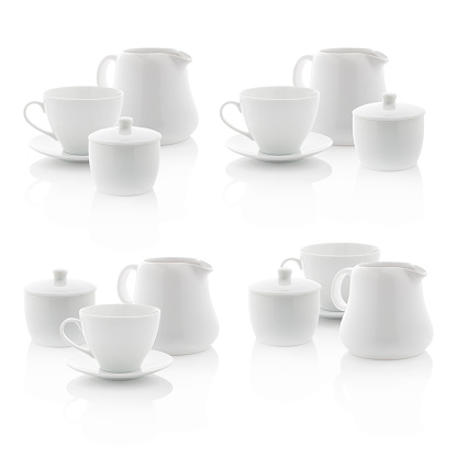 White milk jug, sugar bowl and coffee cup isolated on white background. (with PS paths)