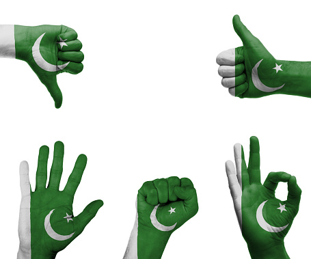 A set of hands with different gestures wrapped in the flag of Pakistan