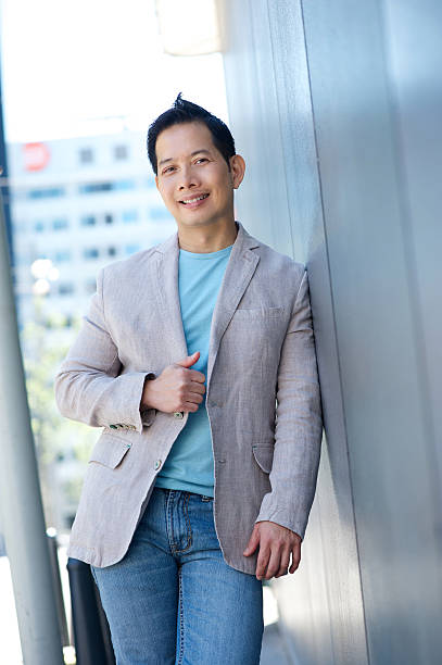 istock Charming asian man smiling outdoors 499846179