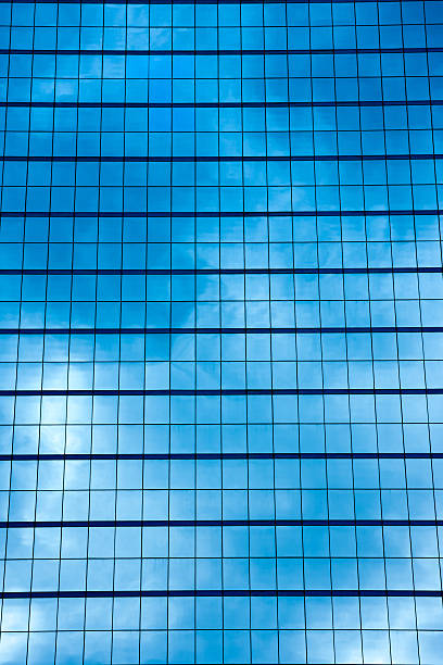 istock Blue sky and white cloud reflecting on mirror's building 499846602