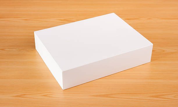 istock Blank white box mock up on wood background 499847790