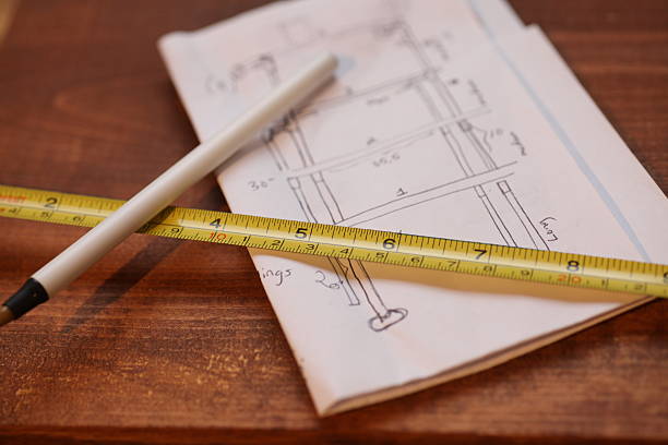 istock measuring tape and pen rests on design 499848244