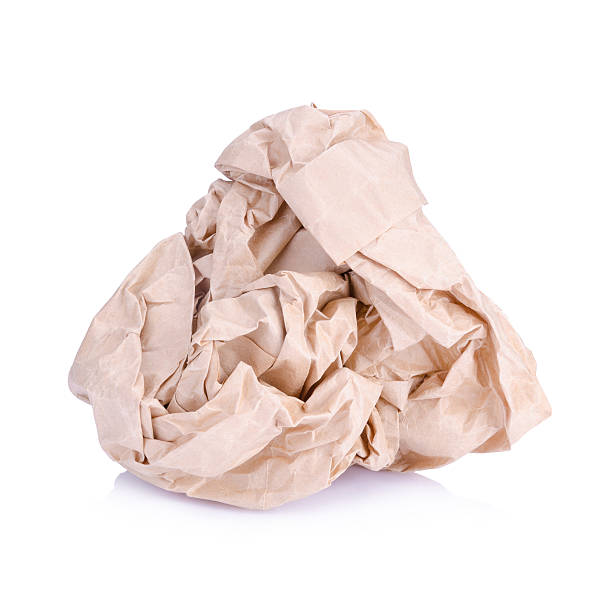 istock Crumpled brown paper balls isolated on white 499850572