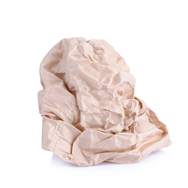 istock Crumpled brown paper balls isolated on white 499850622