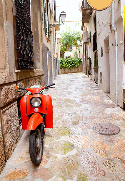 istock Mediterranean street with old retro red scooter in Mallorca 499851696