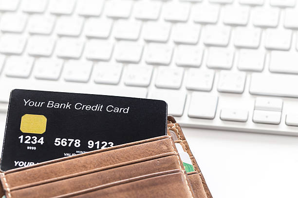 istock Credit Card In Wallet with White Keyboard In Background 499853794