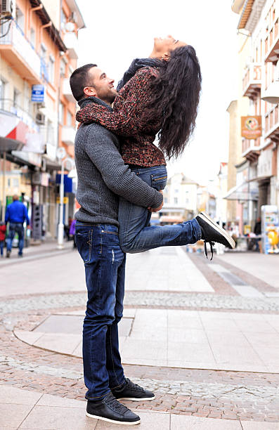 istock Boy lif a girl head back 499854032