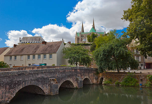 Historic quarter of Chartres, France Historic quarter of Chartres, France with famous cathedral on the background and ancient stone bridge on the foreground chartres cathedral stock pictures, royalty-free photos & images