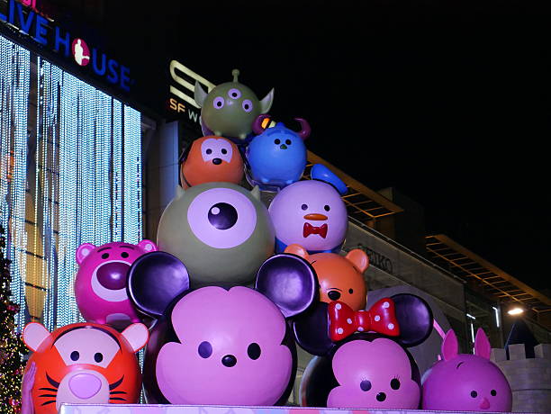 Bangkok, Thailand – December 4, 2015: People come to enjoy the Christmas lights at night. The light display and decoration is located in front of Central World Shopping Mall in Bangkok. Some walk around the area. Some take photos.