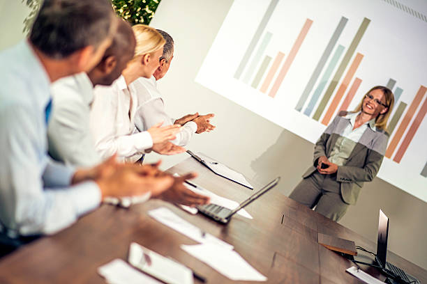 istock Adult Students Applauding Great Presentation at a Conference 499867331