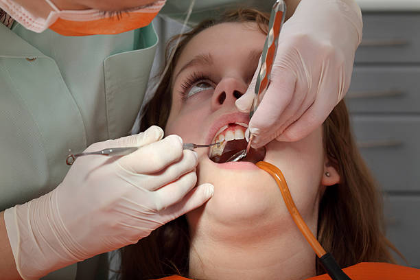 istock Dental procedure, drilling and filling tooth 499867495