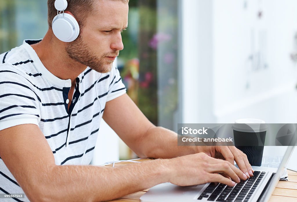 He's got his business tunes on Shot of a handsome young man working on a laptop outsidehttp://195.154.178.81/DATA/i_collage/pu/shoots/784860.jpg Adult Stock Photo