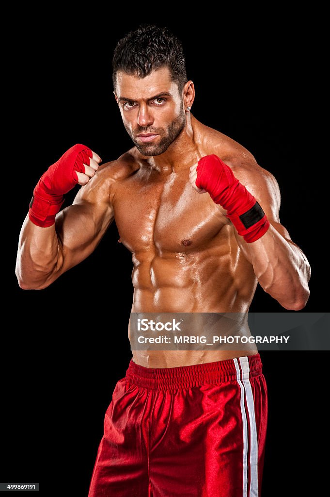 Fighter Muscular boxer, MMA fighter practice his skills  Abdominal Muscle Stock Photo