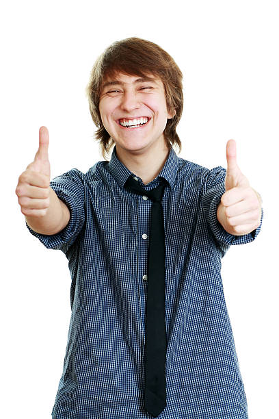 istock smiling young man with thumbs up 499870865