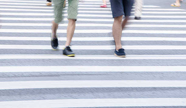 istock People across the zebra crossing 499871055