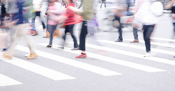 istock People across the zebra crossing 499871091