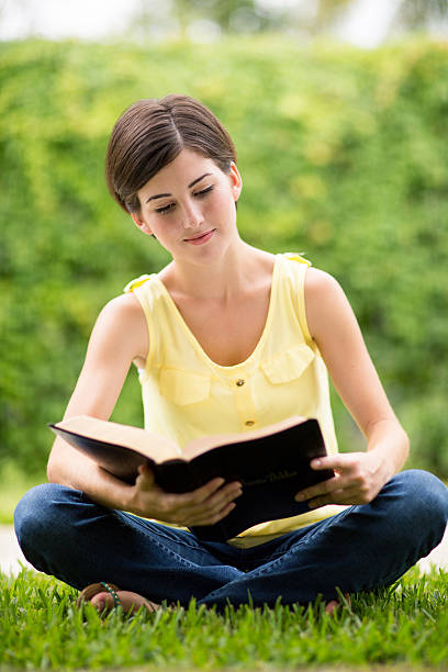 istock Hispanic woman reading bible 499872205